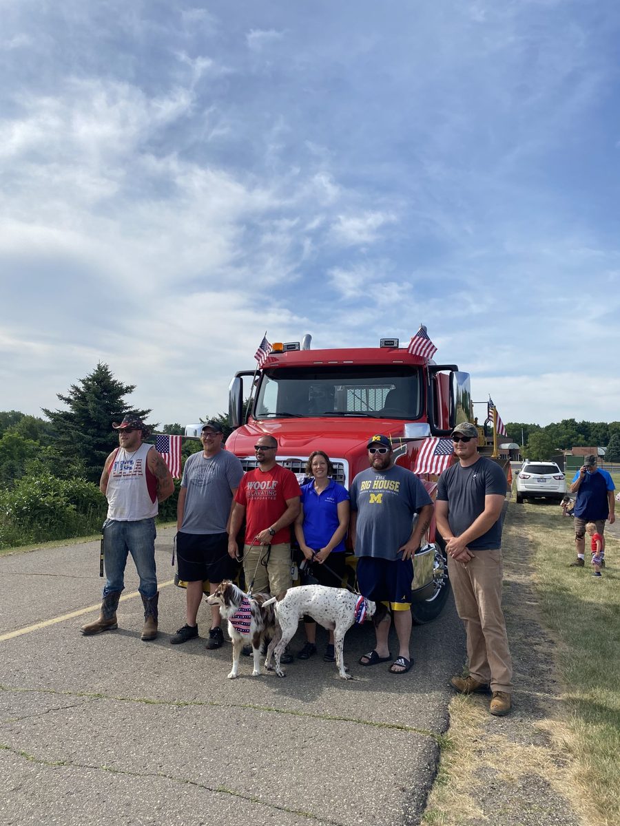 The Woolf Excavating crew with a company truck